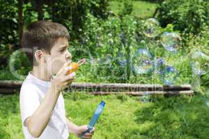 Child makes bubbles