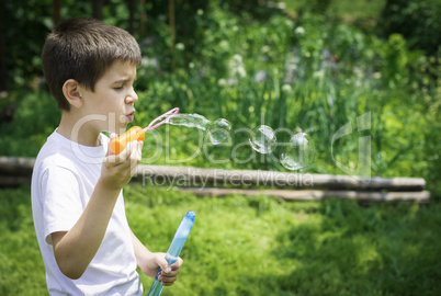 Child makes bubbles