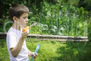 Child makes bubbles