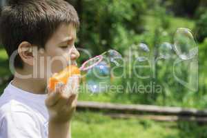 Child makes bubbles