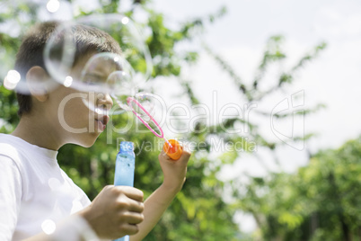 Child makes bubbles