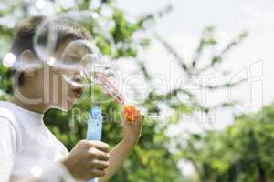 Child makes bubbles