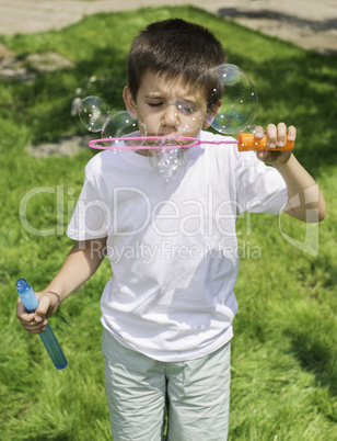 Child makes bubbles