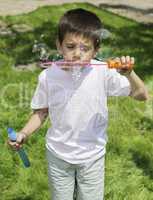 Child makes bubbles