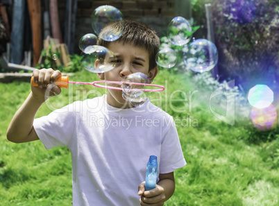 Child makes bubbles