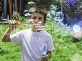 Child makes bubbles