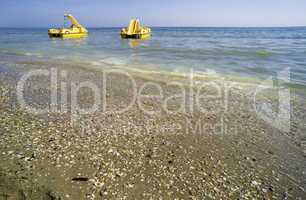 Yellow lifeboat on the beach.