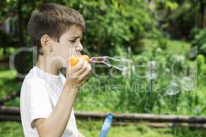 Child makes bubbles