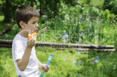 Child makes bubbles