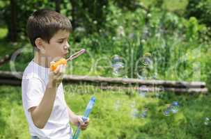 Child makes bubbles