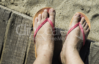 Women foots on the beach