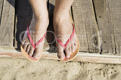 Women foots on the beach