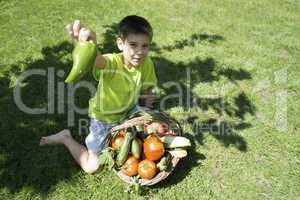Child and basket with vegetables