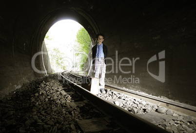 Child walking on railway road