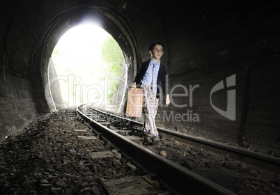 Child walking on railway road