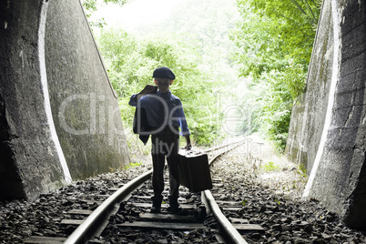 Child walking on railway road