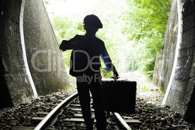 Child walking on railway road