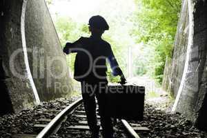 Child walking on railway road