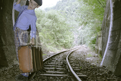 Child walking on railway road