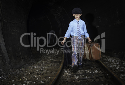 Child walking on railway road