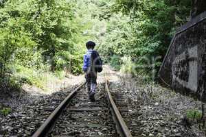 Child walking on railway