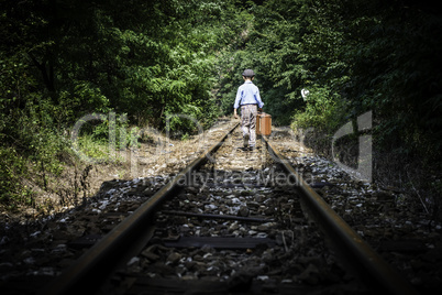 Child walking on railway