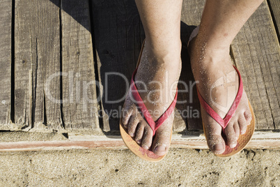 Women foots on the beach