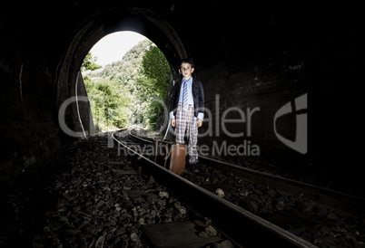 Child walking on railway road