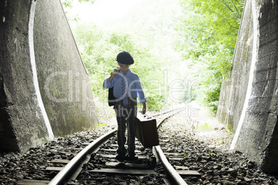 Child walking on railway road