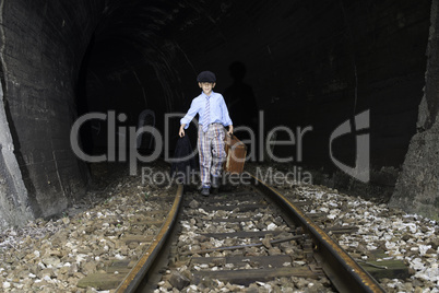 Child walking on railway road