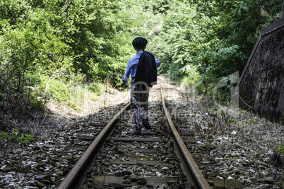 Child walking on railway