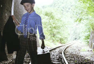 Child walking on railway road