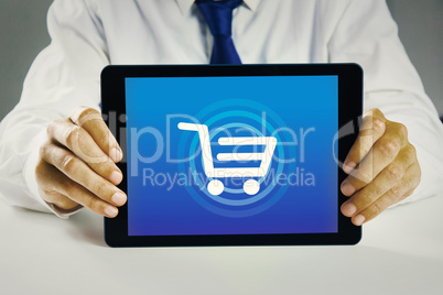 Composite image of businessman showing tablet pc