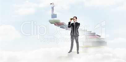 Composite image of elegant businessman standing and using binocu