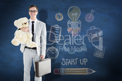 Composite image of handsome businessman holding briefcase and te