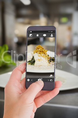 Composite image of female hand holding a smartphone