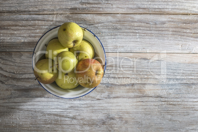 Apples in vintage metal cup