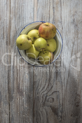 Apples in vintage metal cup