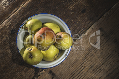 Apples in vintage metal cup