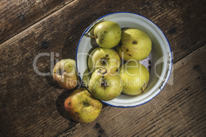 Apples in vintage metal cup