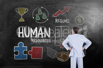 Composite image of serious businessman with hands on hips Composite image of serious businessman with hands on hips