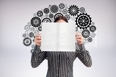 Composite image of businesswoman showing a white card in front o