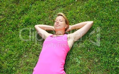 woman lying on grass