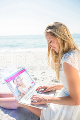 Composite image of  woman using laptop and wearing hat
