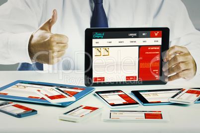 Composite image of businessman showing tablet pc