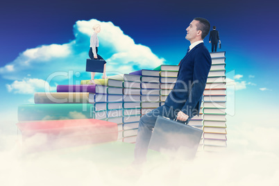 Composite image of businesswoman climbing with briefcase