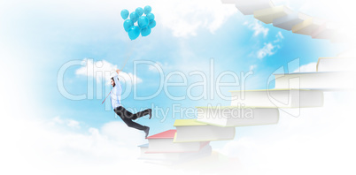 Composite image of businessman flying with balloons