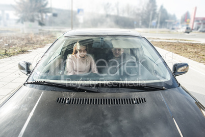  Young boy and women in car