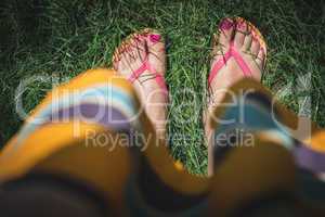 Feet on green meadow