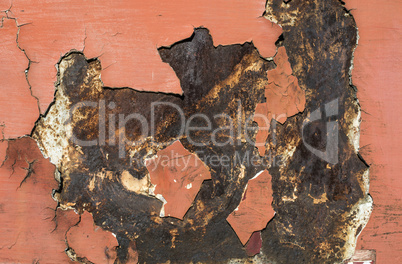 Cracked paint on rusty iron